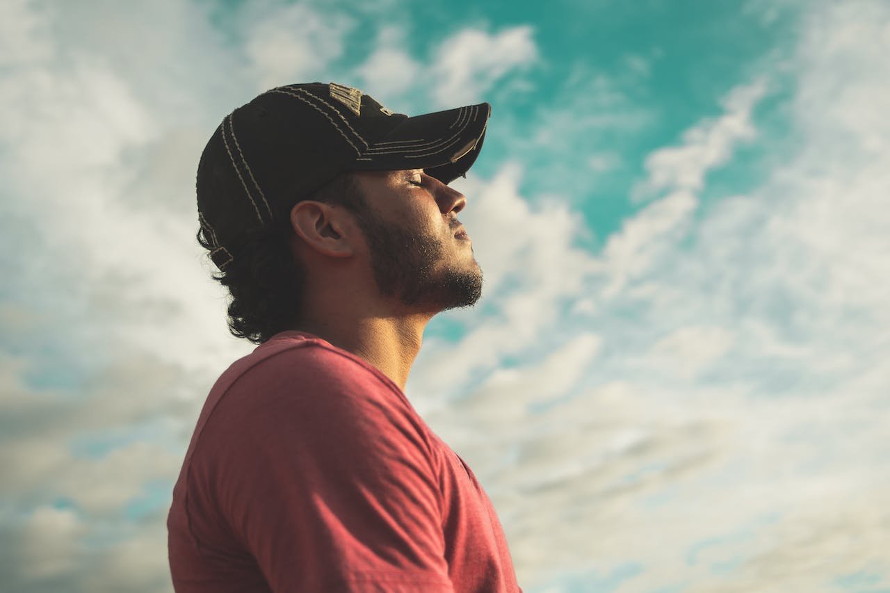 man taking a deep breath